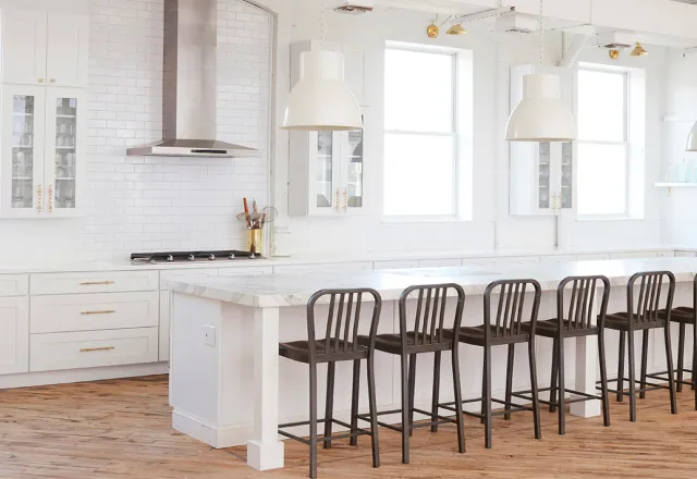 Our bright, white Kitchen studio with big, marble island