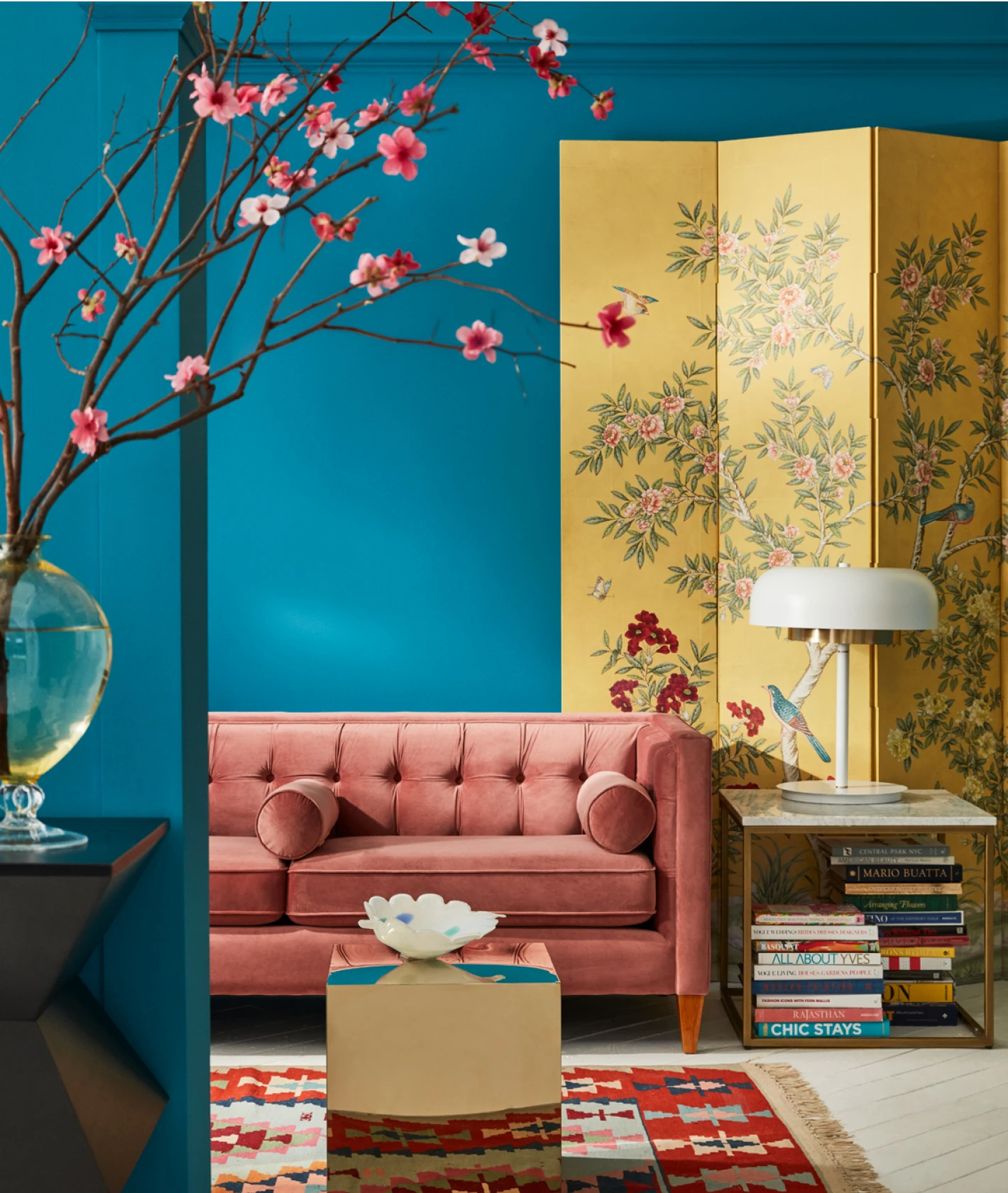 Living room set with pink sofa and yellow floral screen