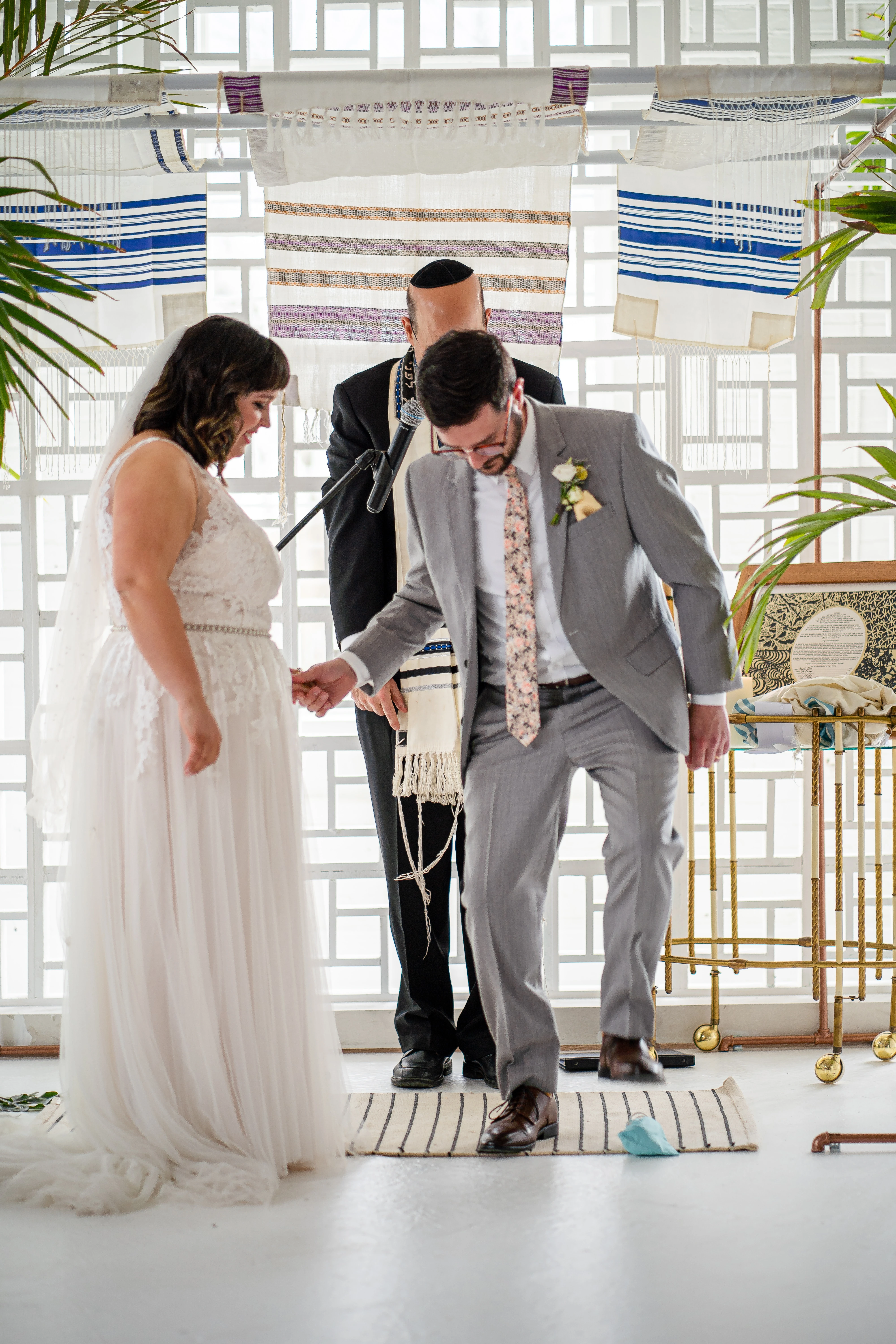 A groom breaking a glass at a Jewish wedding ceremony in the Gallery