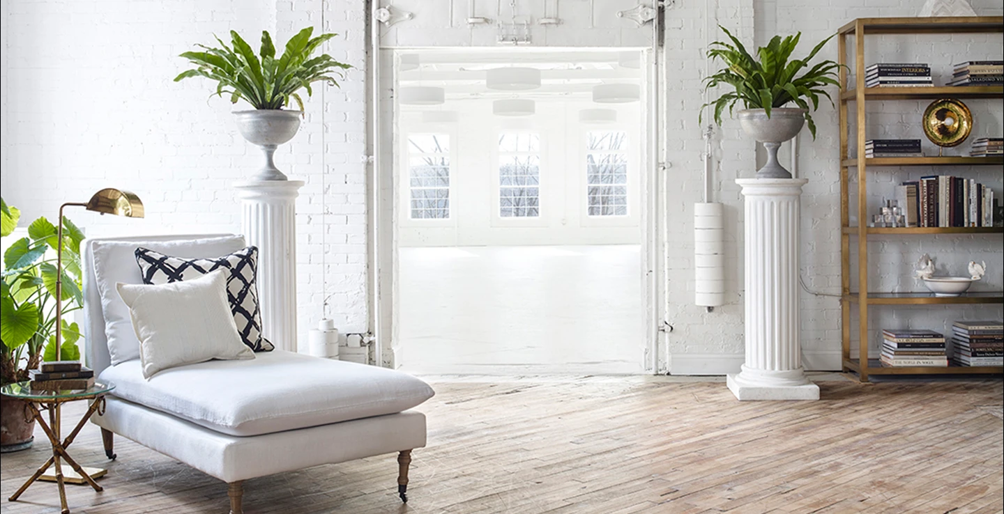 Furnished Loft studio looking into all-white Gallery studio