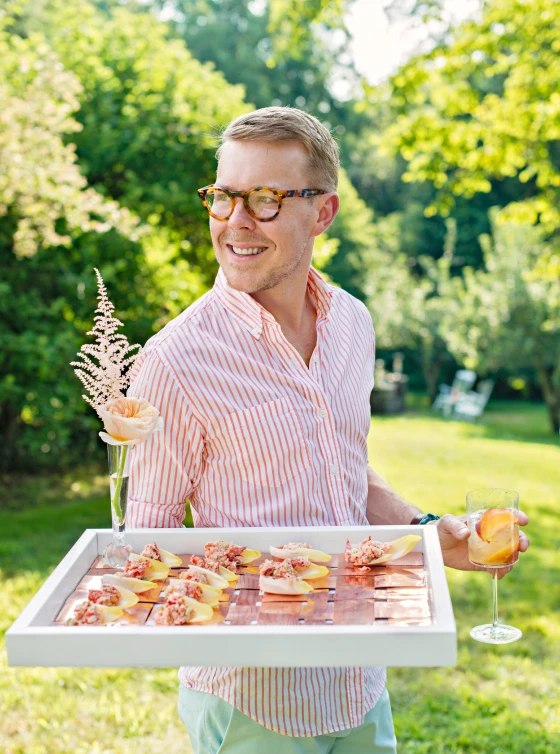 Our Creative Director, Eddie Ross, with tray of hors d'oeuvres