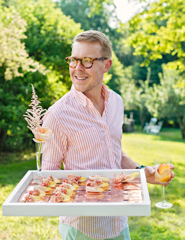 Our Creative Director, Eddie Ross, with tray of hors d'oeuvres