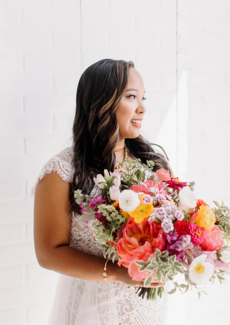 Bride holding bouquet of flowers in the Gallery