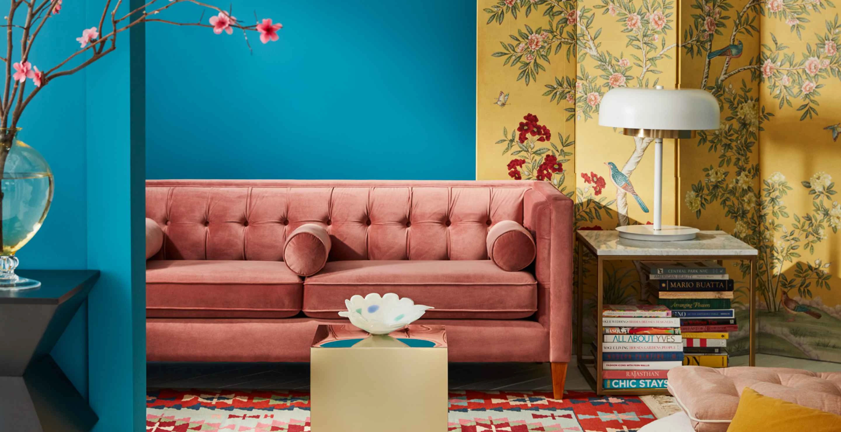 Living room set with pink sofa and yellow floral screen