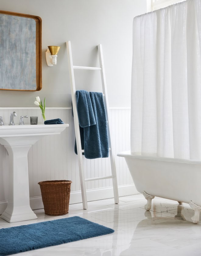 Blue-and-white bathroom set with vintage clawfoot tub