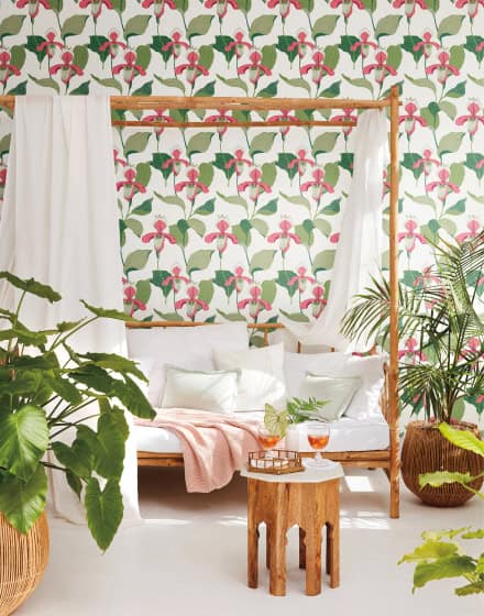 Sun room set with daybed and wallpaper in large botanical print