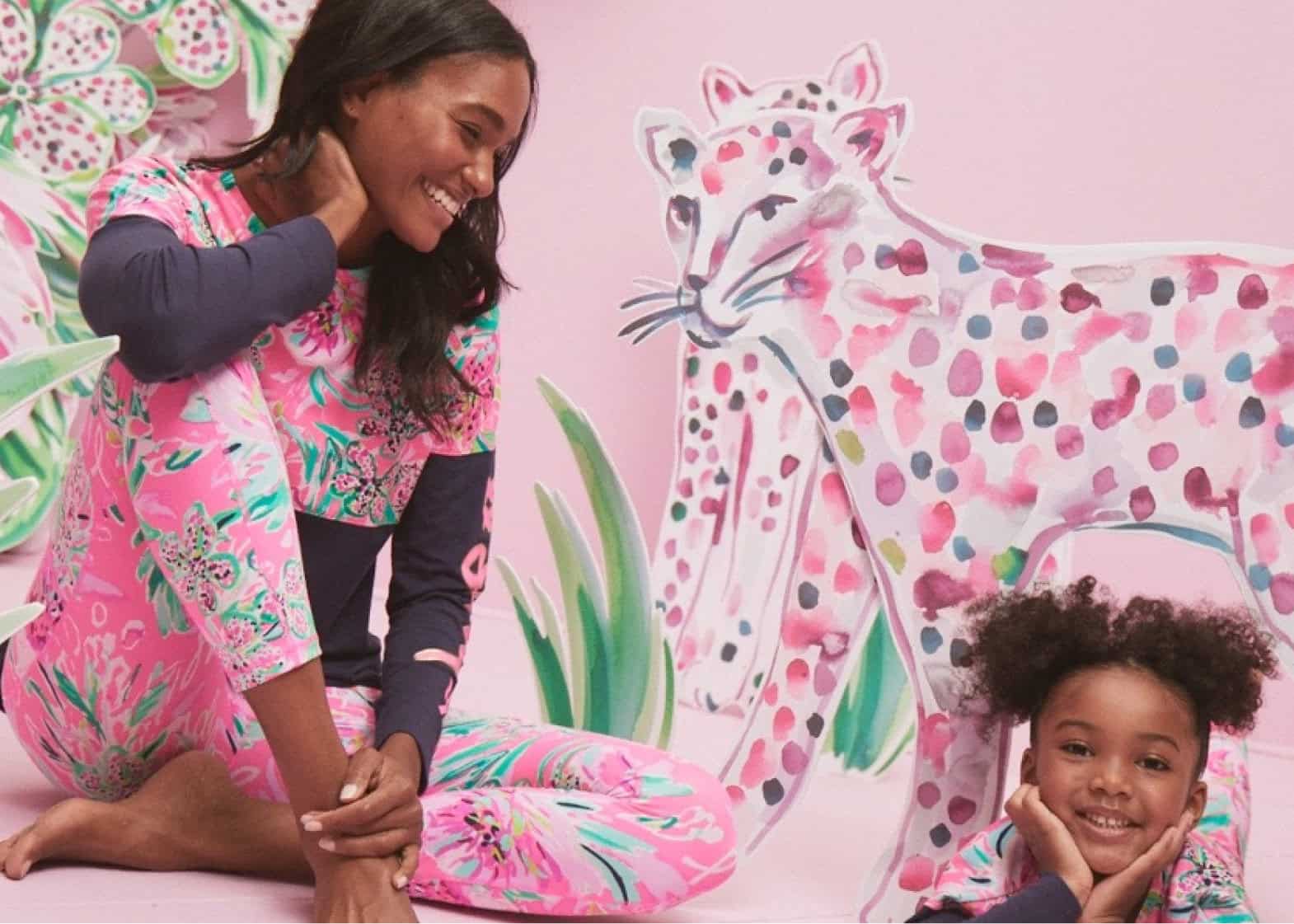 Female mother and child models in pink set with hand painted paper animals