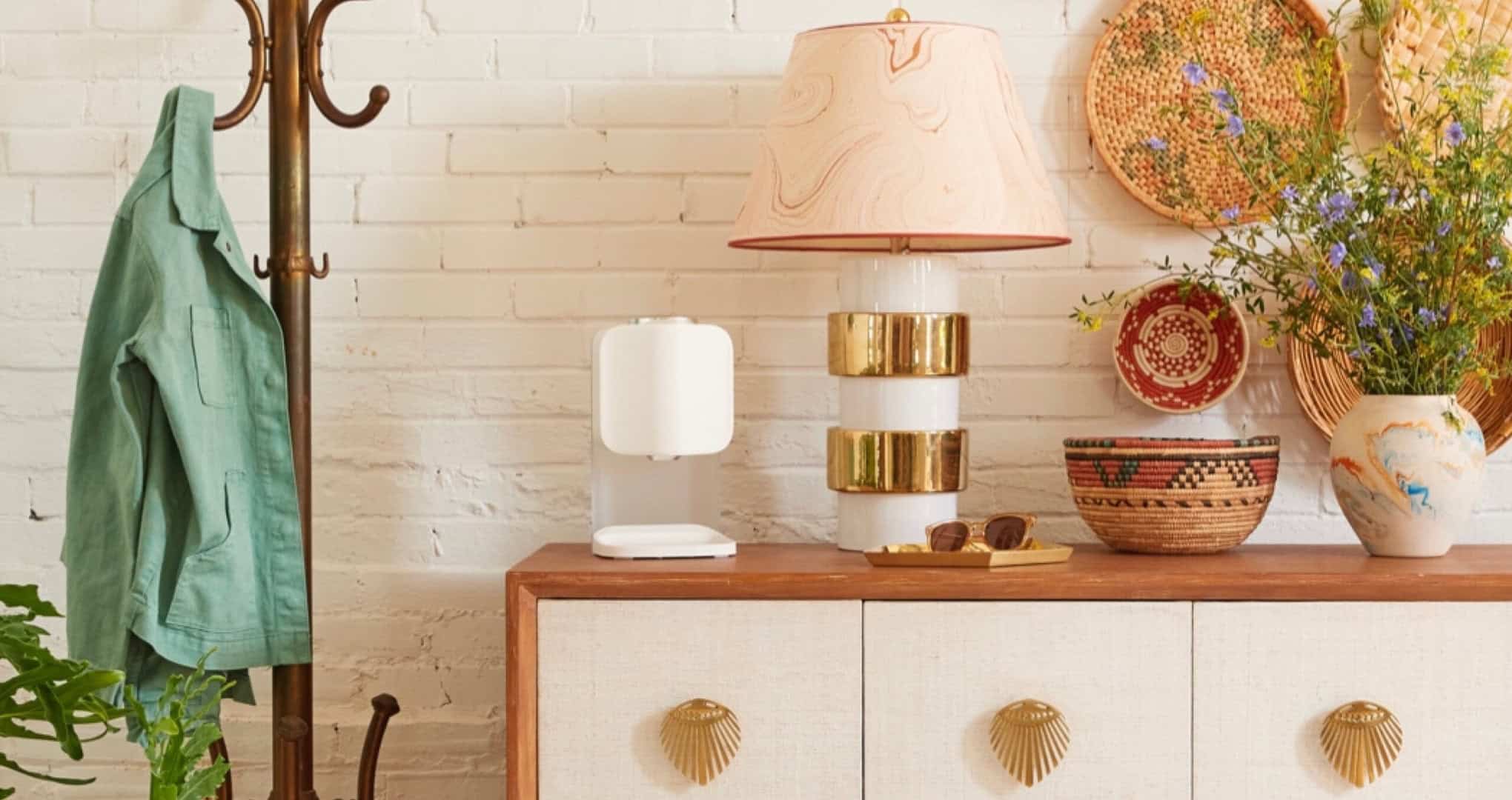 Bohemian-inspired foyer vignette with product on credenza