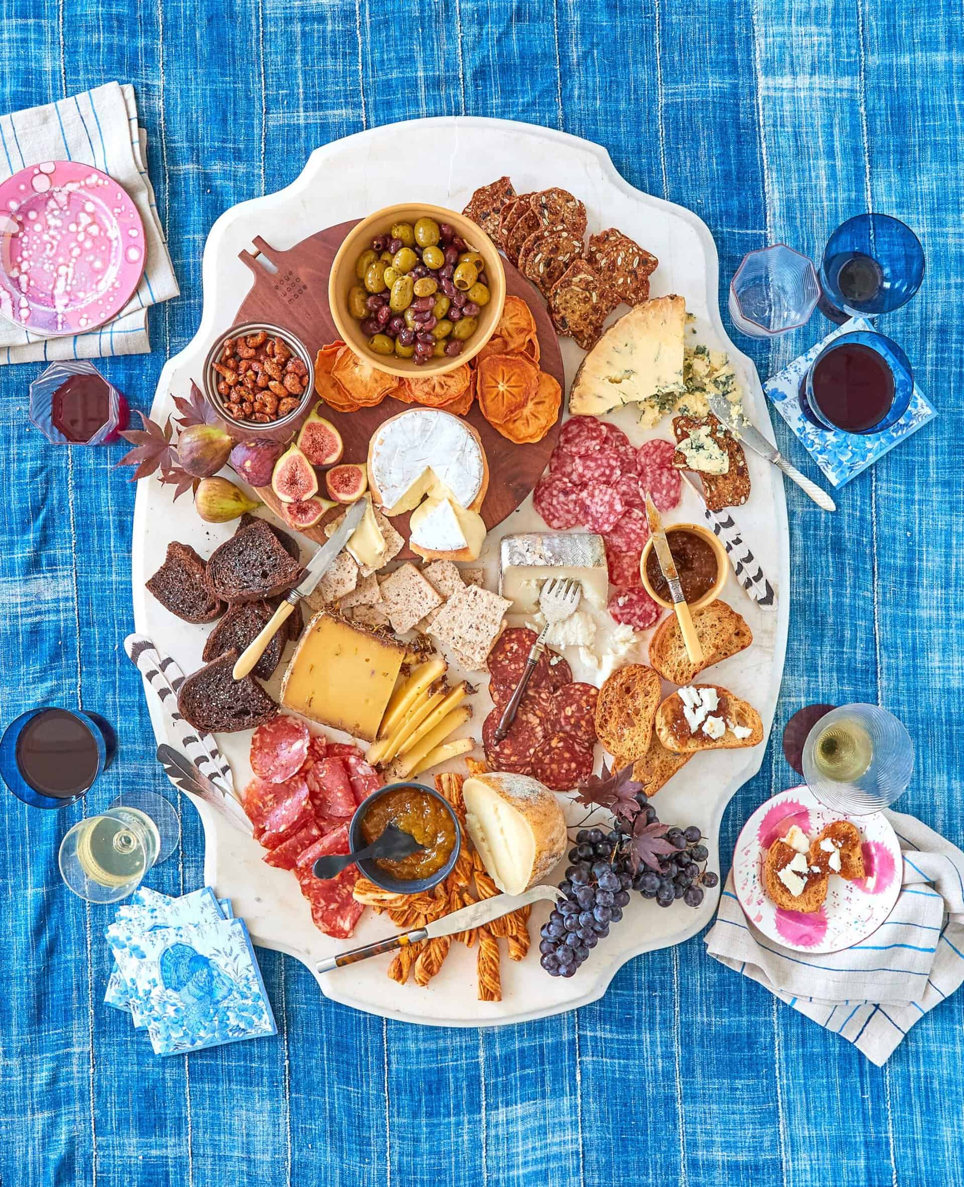 Overhead of elaborate cheese display on marble tabletop