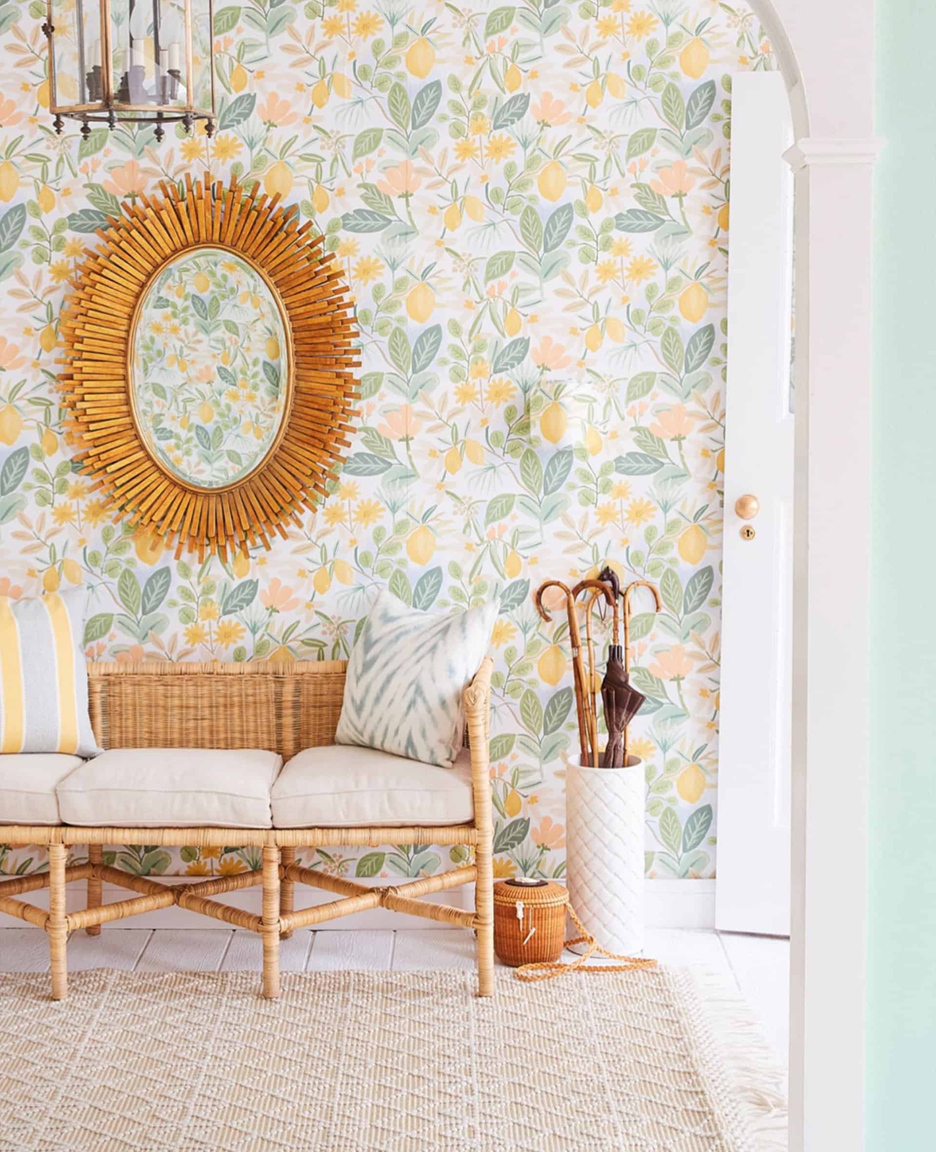 Foyer set with wallpaper and rattan bench and sunburst mirror