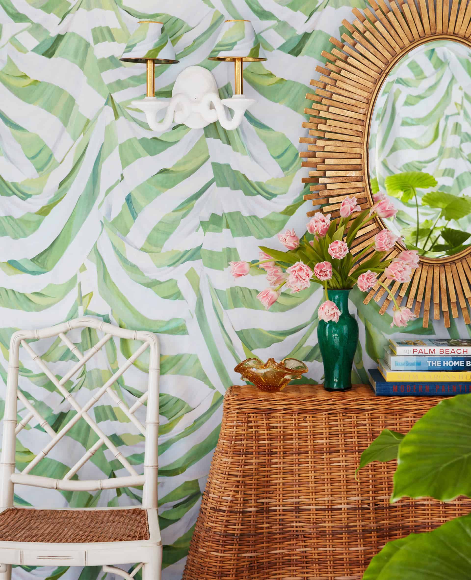 Foyer vignette with mirror and rattan console table