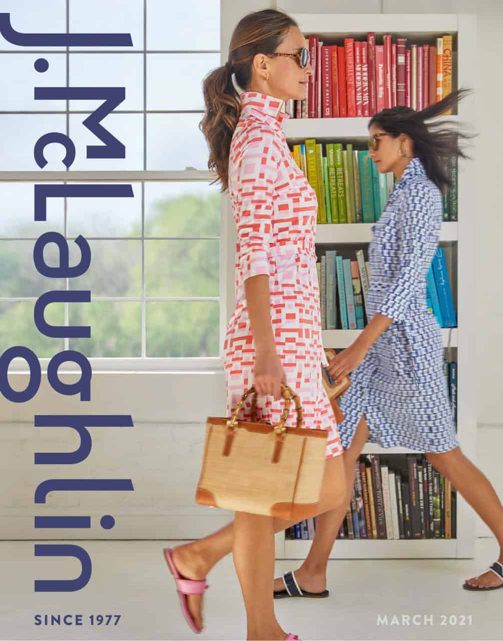 Two female models in our all-white studio with colorful books in background