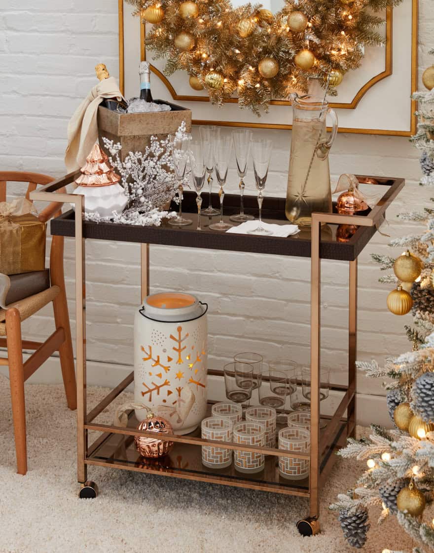 Bar cart in gold tones with champagne