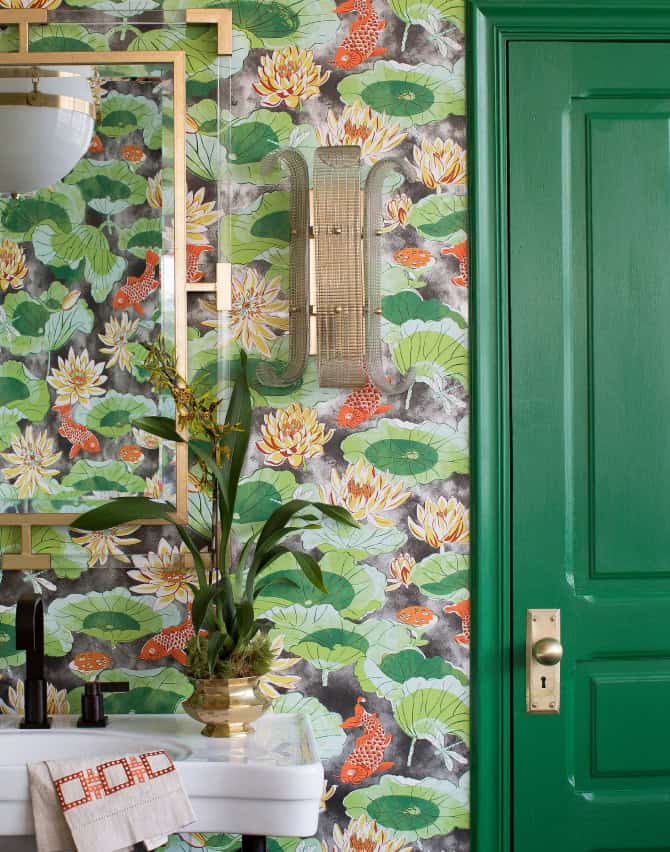 Bathroom set with green door and wallpaper in a koi print