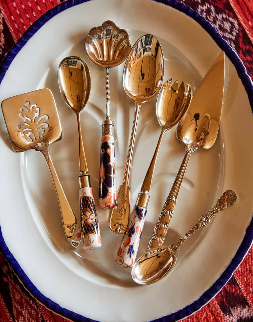 Overhead of vintage serving pieces on a vintage porcelain platter