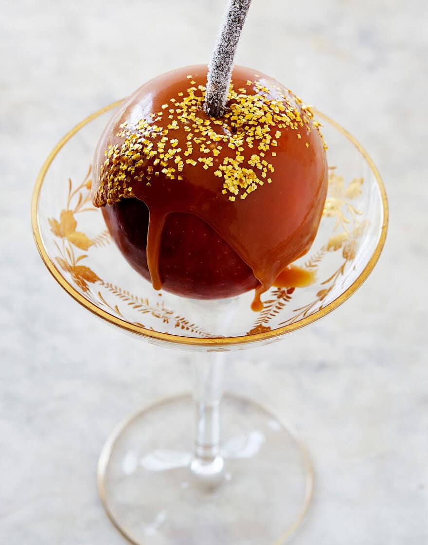 Individual caramel apple dessert in footed glass serving dish