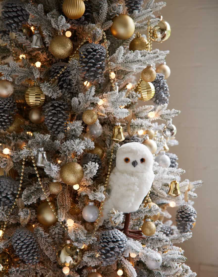 Detail of white owl ornament in a Christmas tree