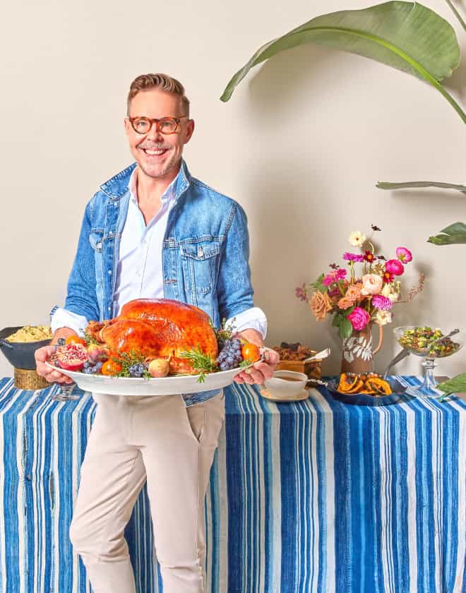 our Chief Content Officer, Eddie Ross, holding a beautiful turkey on a vintage platter