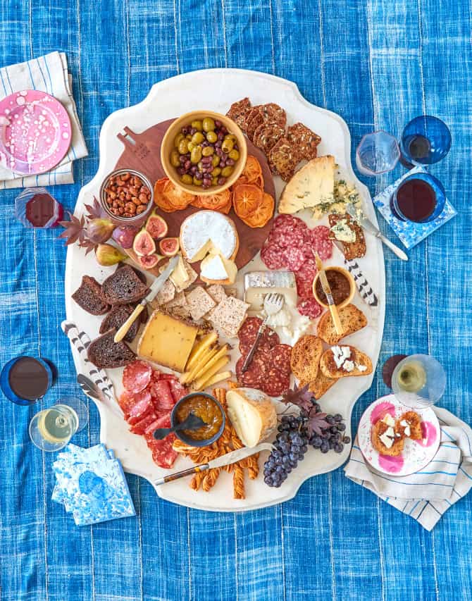 Overhead of elaborate cheese display on marble surface