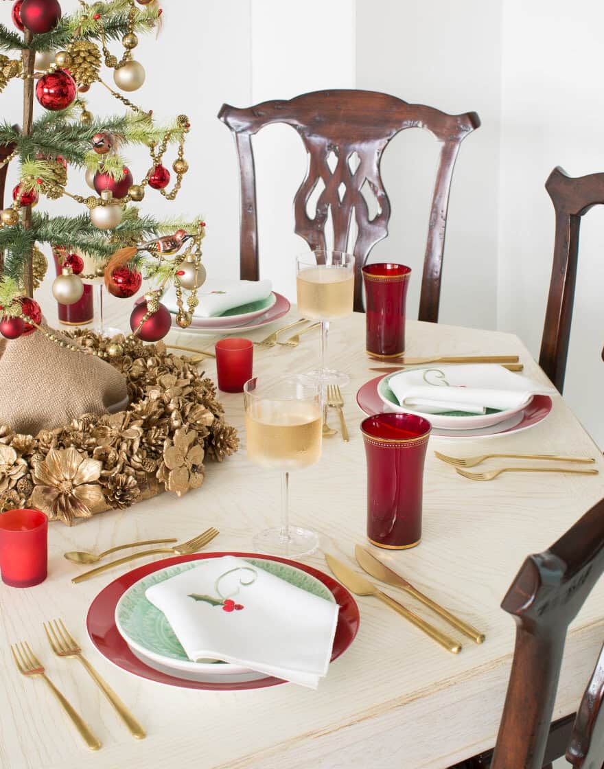 Holiday table setting in traditional red and green with Queen Anne chairs