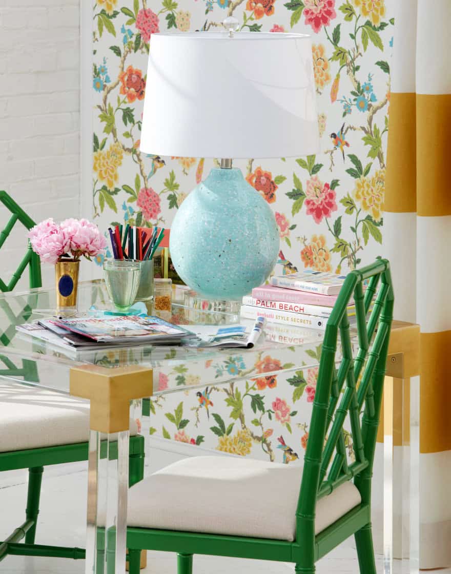 Table lamp vignette in brightly colored home office set with green lattice-back chair