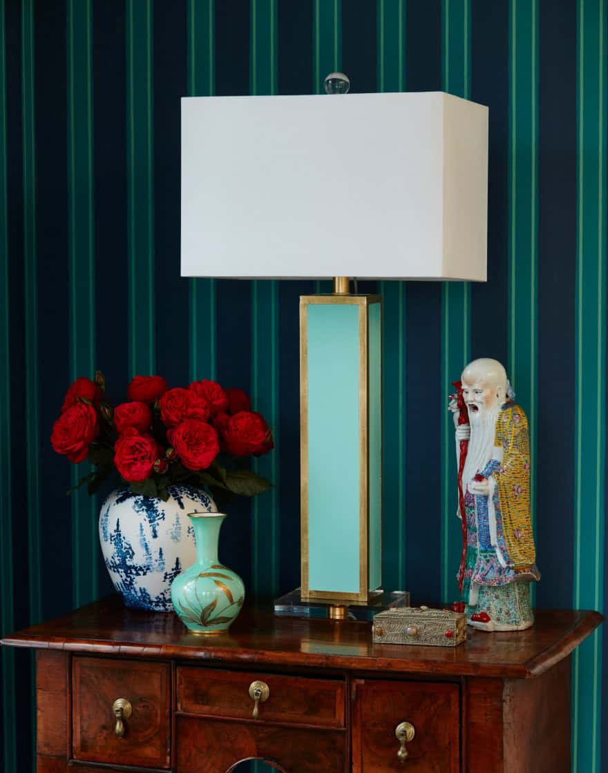 Table lamp with moody blue striped wallpaper